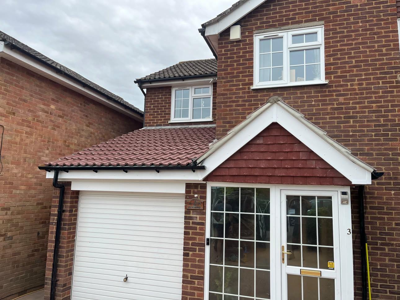 Tiled porch and garage roofs